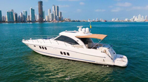 Guests lounging in the shaded rear seating area of the 62ft Sea Ray