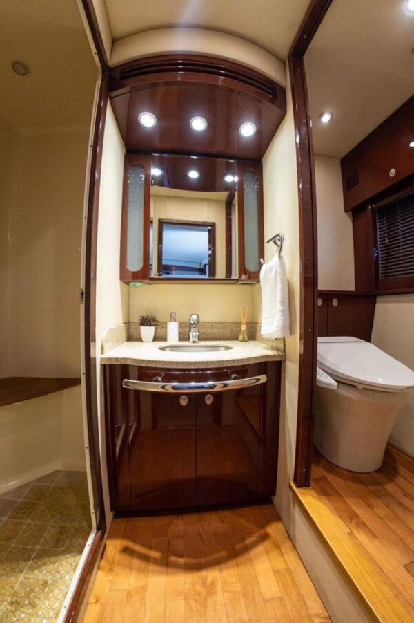 62ft Sea Ray yacht docked at luxury marina with crew on standby