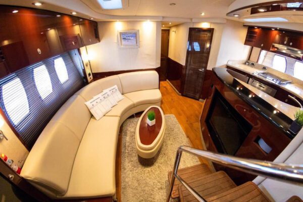 Guests toasting with champagne on the rear deck of 62ft Sea Ray