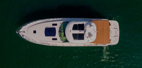 Guests toasting with champagne on the rear deck of 62ft Sea Ray