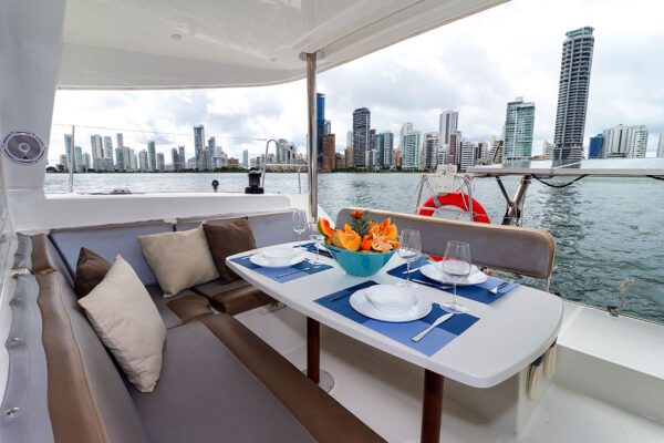 Interior seating area of Xem 3 Lagoon 400 with large windows