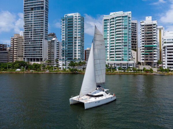 Chicote catamaran near coral reef waters with snorkeling guests
