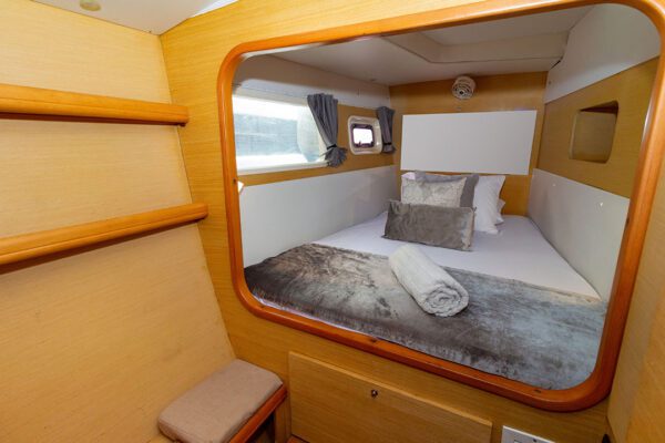 Interior of Chicote catamaran with seating and shaded dining area