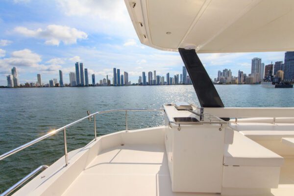 New Horizon catamaran lit up during sunset cruise