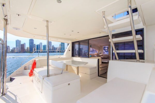 Front trampoline of New Horizon catamaran with guests relaxing