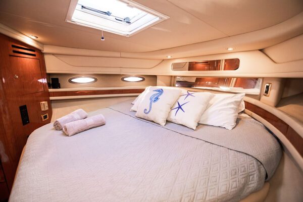 Guests relaxing on the bow of the Palladium yacht with ocean views