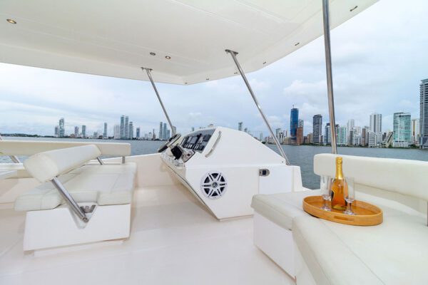 Close-up of the catamaran’s helm with Cartagena skyline