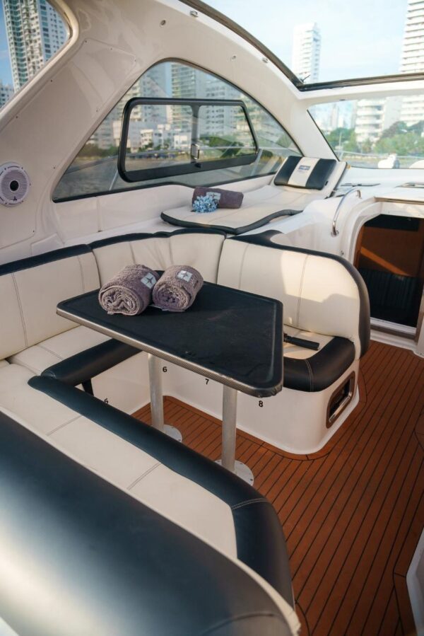 Guests toasting champagne on the bow of Ambar yacht