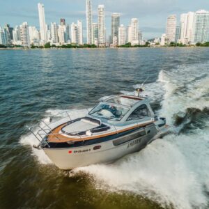 Ambar yacht cruising beside other luxury boats near Cholon