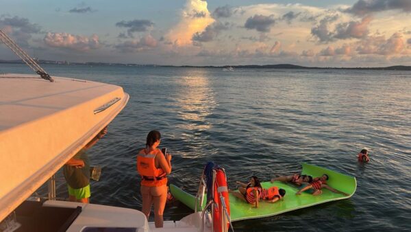 Guests enjoying a swim next to anchored Avalon