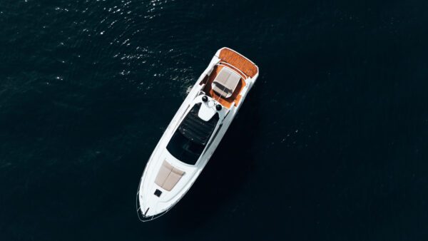 Aerial shot of Myriam Esther V surrounded by turquoise water