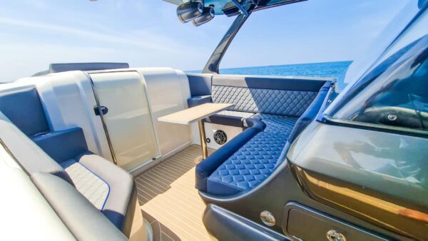 Speedboat-style mini yacht with quad outboards in the Caribbean.