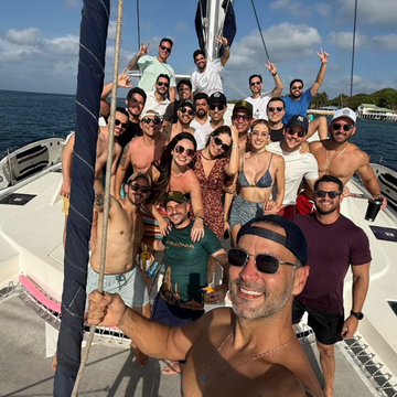 Friends dancing on a Cartagena sunset bay boat tour