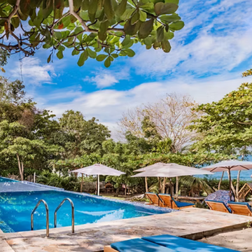 Beach club pool and lounge area on a Cartagena island day trip