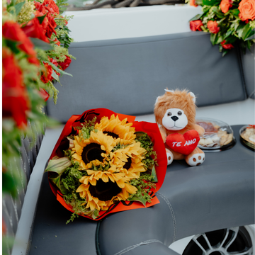 Couple with sunflowers during a romantic Cartagena boat tour