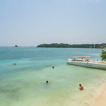 Waterfront loungers and shaded deck at Isla Mulata on a Rosario Islands tour from Cartagena.