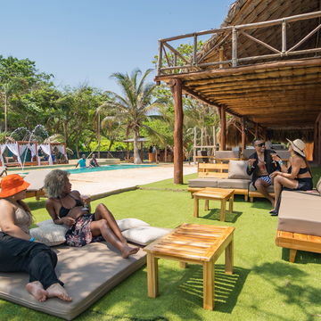 Rustic beach club palapa and tropical scenery at Isla Mulata on the Cartagena 3 Island Tour.