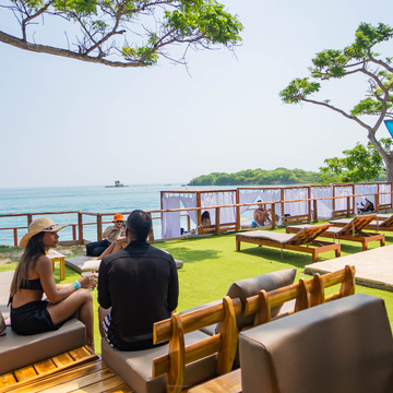 Shaded seating area with Caribbean water views at Isla Mulata near Cartagena.