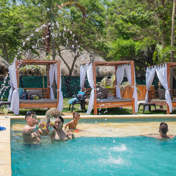 Pool surrounded by tropical trees at Isla Mulata during a Cartagena island hopping tour.