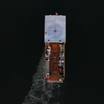 Aerial view of the Santa María catamaran cruising through Cartagena Bay during the VIP sunset tour.